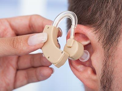 inserting hearing aid